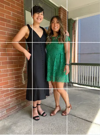 Two women with a grid of 9 equal rectangles overlaid on the photo, their heads are in the top third, near the edge